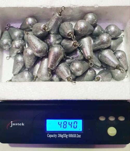 Rivernsea 4oz lead bomb fishing sinkers with swivels, bulk 44 piece pack shown on a digital scale
