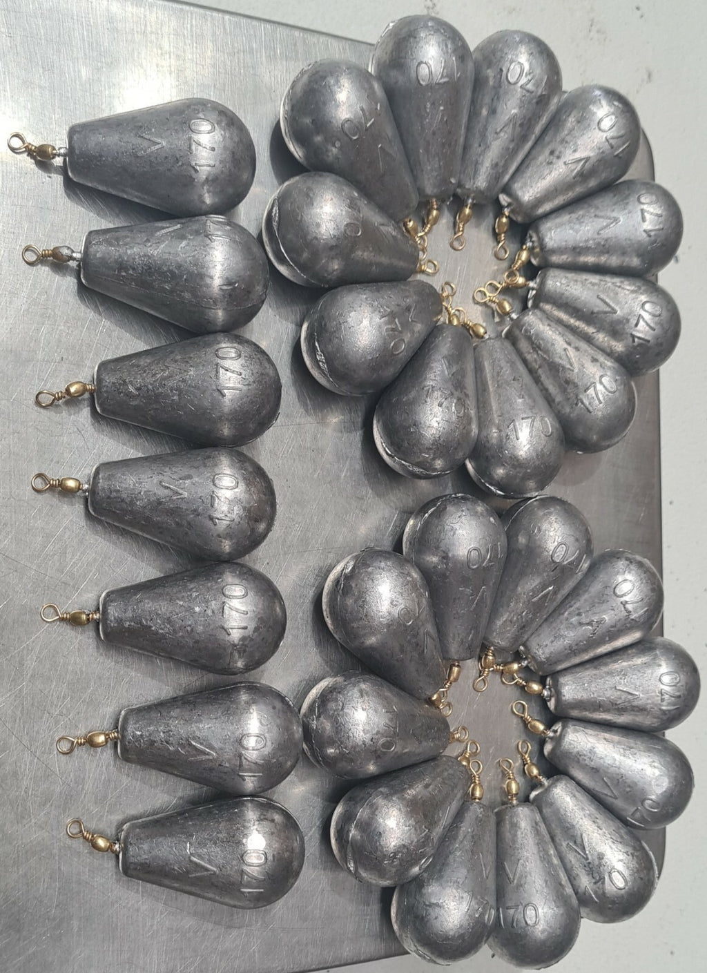 Rivernsea 6oz lead bomb fishing sinkers with swivels, 29 piece pack with smooth CNC finish on a metal surface